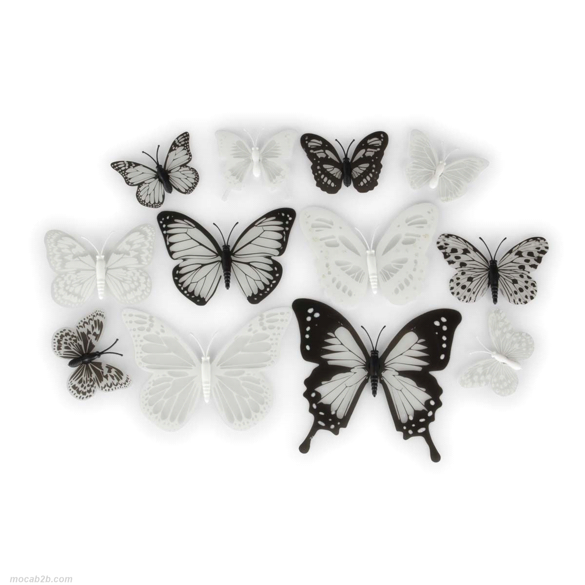 Farfalle bianche e nere in pvc con magnete. Dimensioni: 5 x 10,8/ 6,4x12cm. 