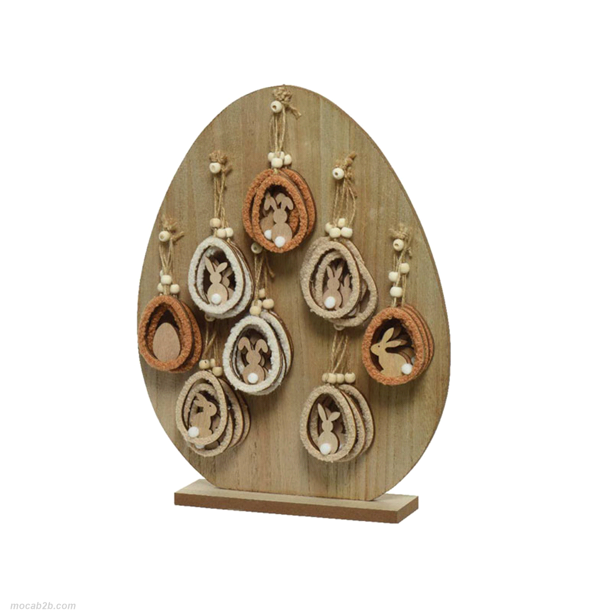 Uova di legno con coniglietti e pompom assortiti da appendere. Misure 0,3x5 h.7,5cm. 